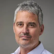 young, gray-haired man in white shirt