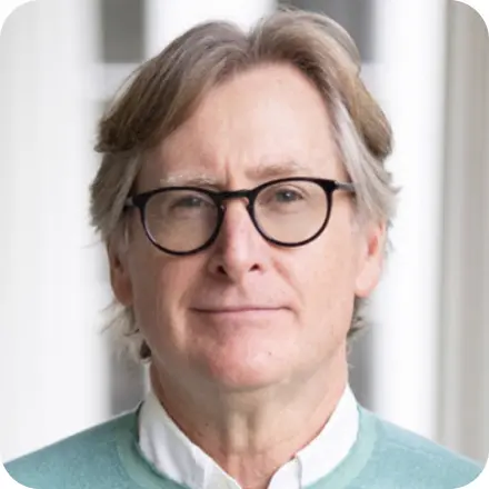 Man with glasses and aqua sweater