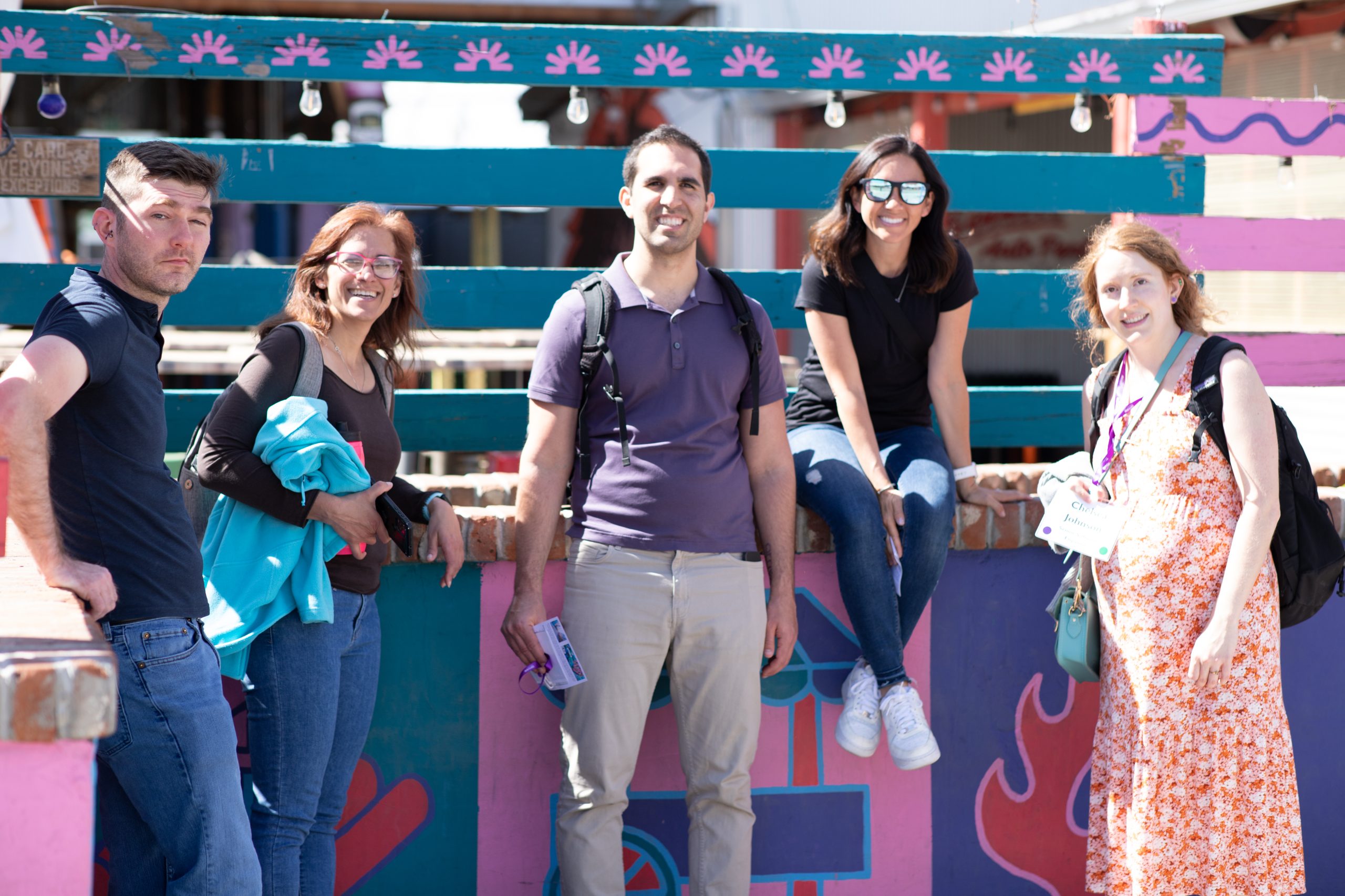 One man and three women at outdoor event