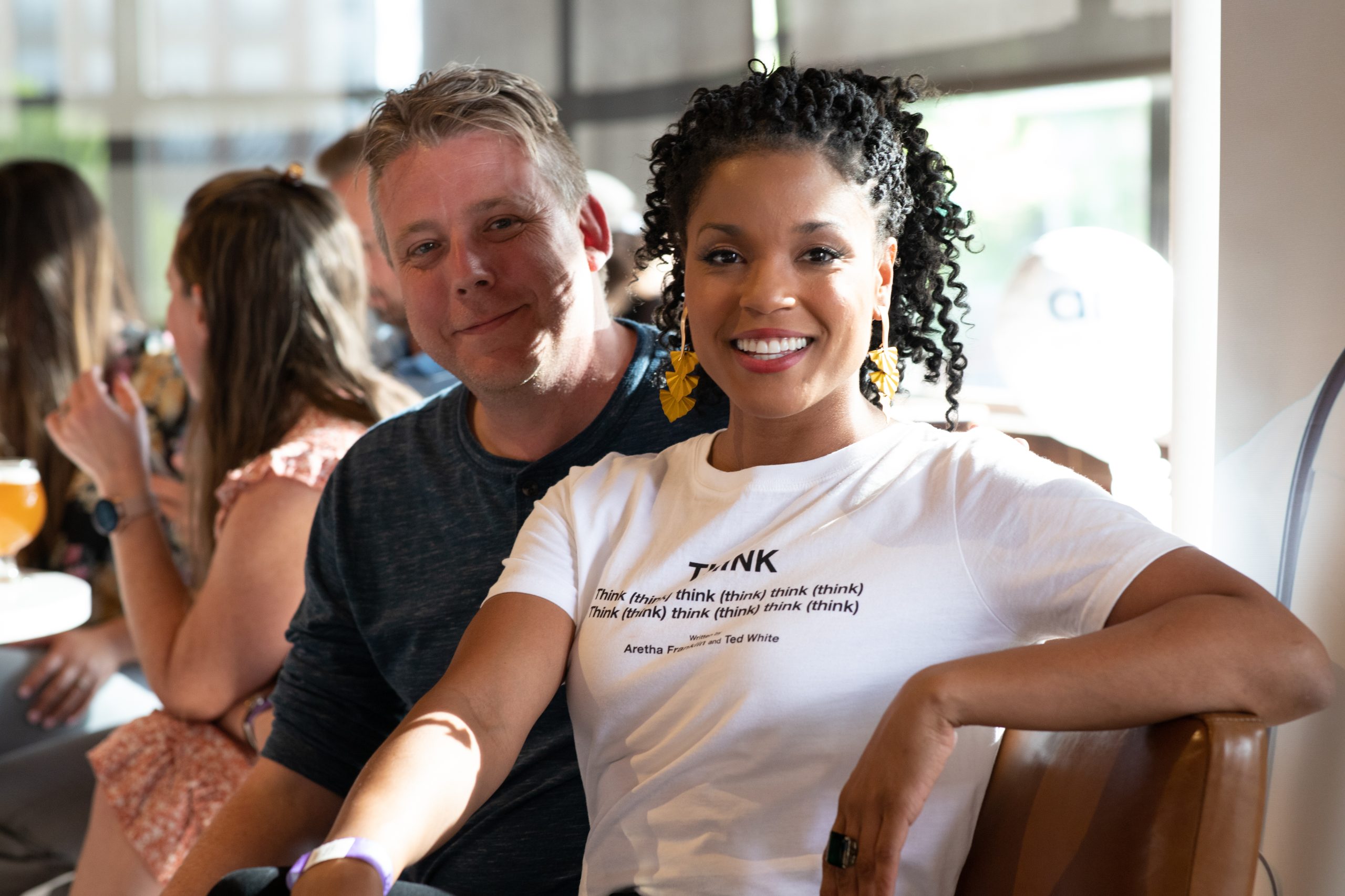 White man and Black woman pose for a photo