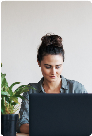Woman at computer, with hair up